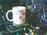 Click to view Charl's mug sitting on a pile of PCBs that he will be scavenging for parts.
